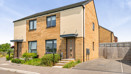 Semi-detached house with driveway, small front garden, and side access gate.