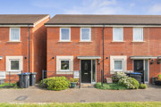 Two-storey red brick semi-detached house with white-framed windows