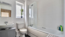 Contemporary family bathroom with bath and shower