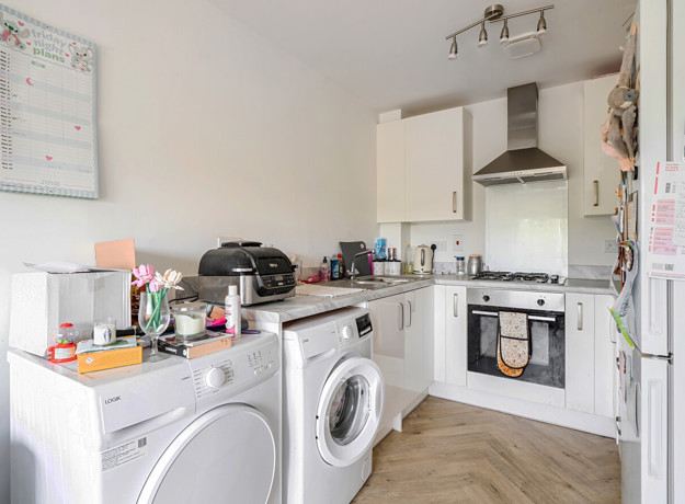 Kitchen with cabinets, appliances, and countertops.