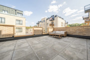 Terrace with paved flooring and outdoor seating area.
