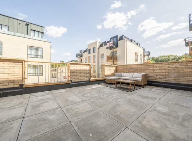 Terrace with paved flooring and outdoor seating area.