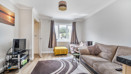 Bright living room with large window and neutral décor