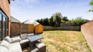 Patio seating area with outdoor furniture and enclosed garden space