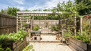 Garden with pergola, gravel area, raised beds, and fencing.