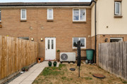 Enclosed rear garden with patio area at terraced property