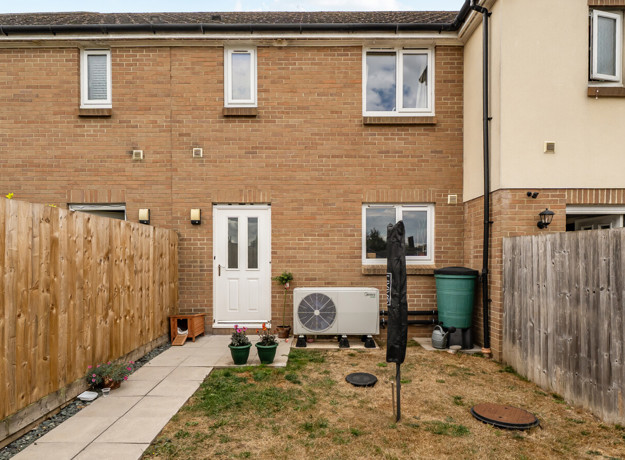 Enclosed rear garden with patio area at terraced property
