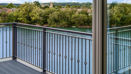 Waterside Balcony Overlooking Lake And Greenery At Herons Lake