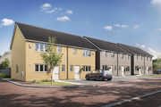 Modern terraced new-build houses on a contemporary housing development with parking and tree-lined streets.