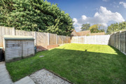 Rear garden with lawn and wooden fencing