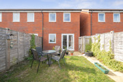 Private rear garden with lawn, fencing and outdoor seating area