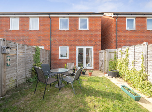 Private rear garden with lawn, fencing and outdoor seating area