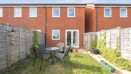 Private rear garden with lawn, fencing and outdoor seating area