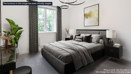 Luxurious main bedroom featuring a king-size bed, soft neutral tones, and generous natural light.